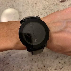Movado watch. Black leather band. Unisex.